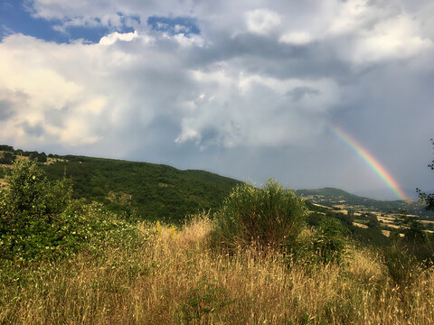 Rainbow in countryside at summer day