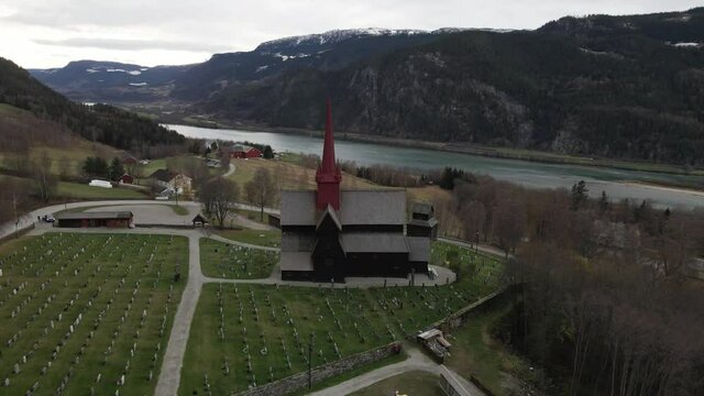 View Of Ringebu Stave Church In Oppland, Norway On A Cloudy Day - aerial drone shot
