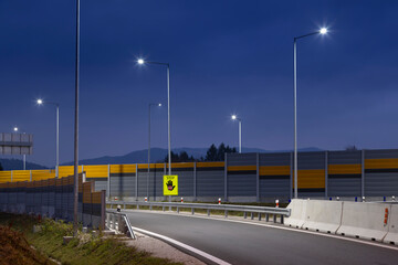 Fototapeta na wymiar highway exit at night with led streetlights