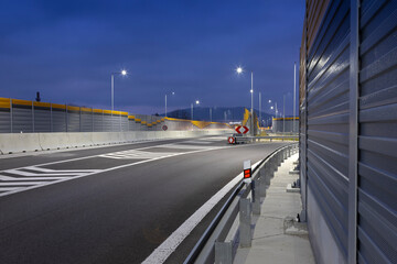 highway exit at night with led streetlights
