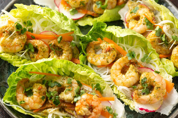Lettuce wraps with Spicy prawn, shrimp and rice vermicelli noodles. Asian style finger party food