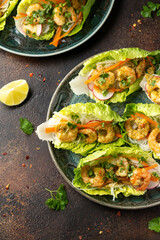 Lettuce wraps with Spicy prawn, shrimp and rice vermicelli noodles. Asian style finger party food