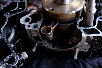 Close-up of the new engine connecting rod of a motorcycle.
