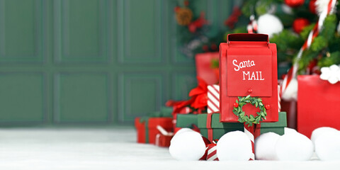 Christmas banner with red santa mail box in front of tree with green background with copy space