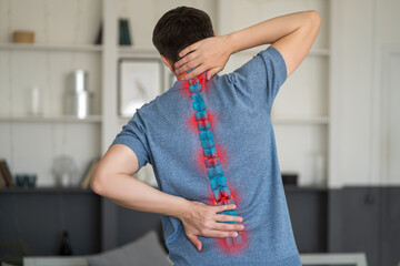 Intervertebral hernia, neck and lumbar pain, man suffering from backache at home, spinal disc...