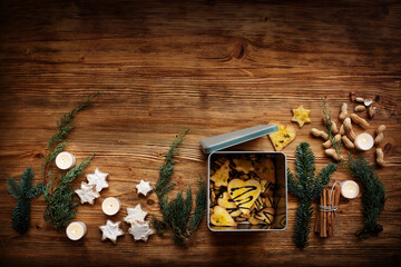 Advent season - homemade cookies for christmas. Sweet christmas decoration on brown rustic wood....