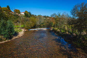 Fototapeta na wymiar shallow river in autumn