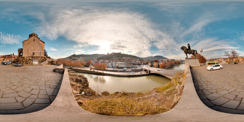 Tbilisi, Georgia - 2021: City center of Tiflis. Kura bridge. Summer. Blue sky. 3D spherical panorama with 360 viewing angle. Ready for virtual reality. Full equirectangular projection. © Stanislau