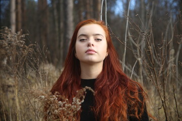 Closeup portrait of a girl red hair pretty cute beauty smiling lifestyle female eyes young woman beautiful portrait face one person forest 