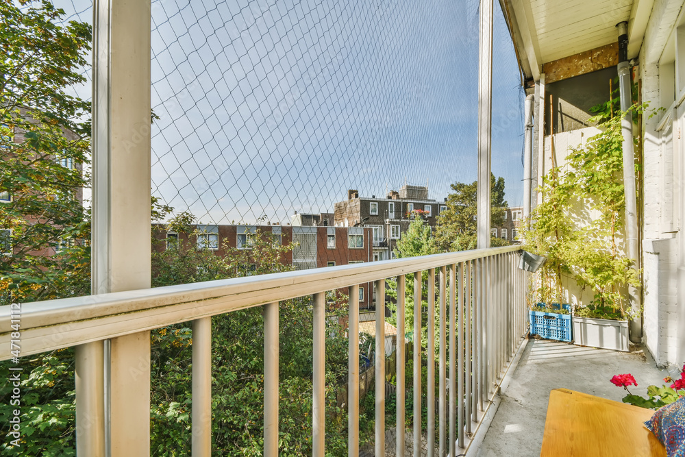 Wall mural cozy nice balcony with a yellow bench