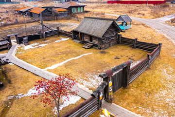 Aerial view on Old rustic wooden house. The village of Nizhnyaya Sinyachikha. Urals. Russia.