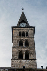 View of the tower of the old medieval church in the town of Arties, in the Aran Valley, Spanish Pyrenees