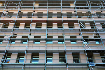 The exterior is being renovated with iron scaffolds installed to renew the exterior of a building on Istiklal Street in Istanbul Turkey.