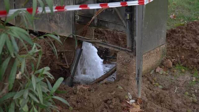 Water leaking out of an underground pipe