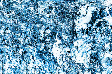 Blue mineral water splash isolated on white in studio. Pure clear flow background. Drinking water texture.