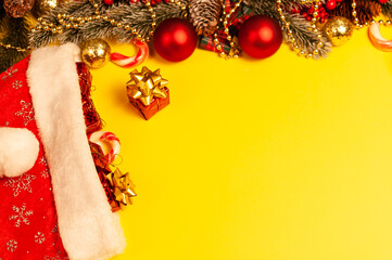Christmas decorations. Christmas. Christmas decorations and gifts. Christmas atmosphere. Noel. Yellow baackground. New Year. Mock up.