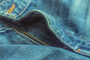 selected focus of zipper on classic denim jeans close up