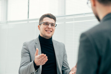 attentive young employee standing in the office