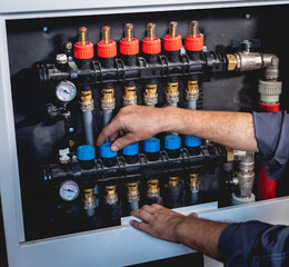 HVAC technician servicing home heating and cooling system