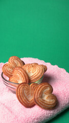 Delicious homemade heart shaped cookie on a color background. Top View. Place for text.