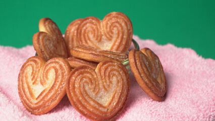 Delicious homemade heart shaped cookie on a color background. Top View. Place for text.