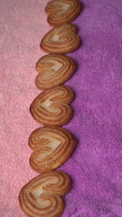 Delicious homemade heart shaped cookie on a color background. Top View. Place for text.