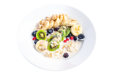 oatmeal fruit breakfast milk, banana, kiwi, berrie, blueberrie meal snack on the table copy space food background