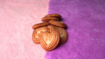 Delicious homemade heart shaped cookie on a color background. Top View. Place for text.