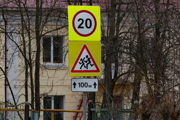 Fototapeta premium Speed limit road sign, children road sign, beware of children. Road signs installed near educational institutions, on the road in the city.