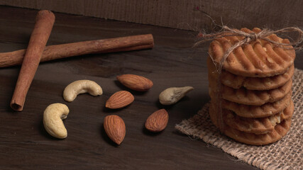 Homemade oatmeal cookies with flax and sesame seeds on white wooden table, copy space. Healthy vegan oat cookies