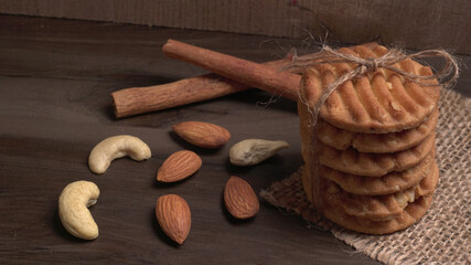Homemade oatmeal cookies with flax and sesame seeds on white wooden table, copy space. Healthy vegan oat cookies