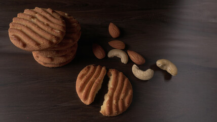 Homemade oatmeal cookies with flax and sesame seeds on white wooden table, copy space. Healthy vegan oat cookies