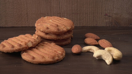 Homemade oatmeal cookies with flax and sesame seeds on white wooden table, copy space. Healthy vegan oat cookies