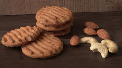 Homemade oatmeal cookies with flax and sesame seeds on white wooden table, copy space. Healthy vegan oat cookies