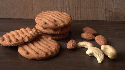 Homemade oatmeal cookies with flax and sesame seeds on white wooden table, copy space. Healthy vegan oat cookies
