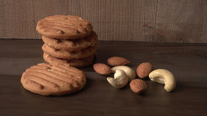 Homemade oatmeal cookies with flax and sesame seeds on white wooden table, copy space. Healthy vegan oat cookies