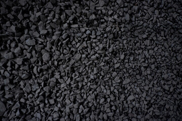 Black small road stone background.