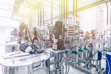 Photo of pipes and tanks. Chemistry and medicine production. Pharmaceutical factory. Interior of a...