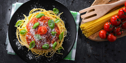 Composition with a plate of spaghetti bolognese