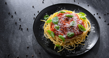 Composition with a plate of spaghetti bolognese
