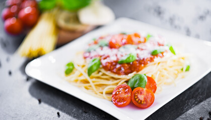 Composition with a plate of spaghetti bolognese