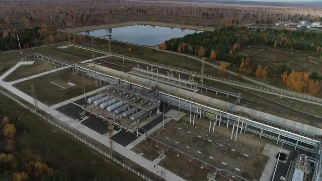 Complex engineering structures of a polymer plant. Summer drone shooting at the factory. Old factory from the times of the USSR