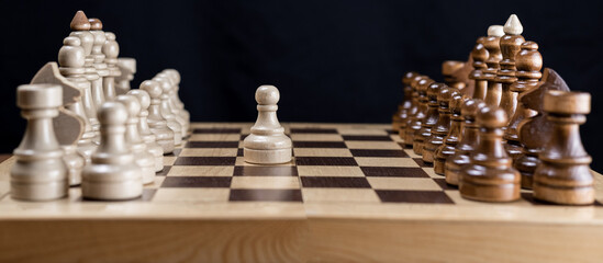 Chess, the beginning of the game. Opening. The white pawn made its first move.