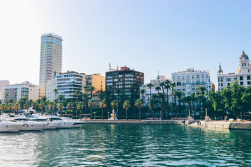 Obraz na płótnie Canvas View of sport seaport with green water in spanish coast city Alicante 