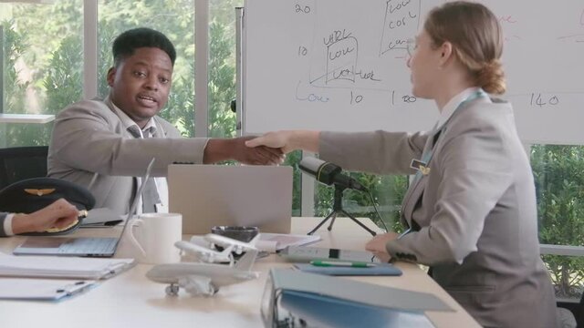 Airline business air hostess and captain aviator in uniform meeting discussion on flight business and training service of stewardess to understand yearly income and promotion
