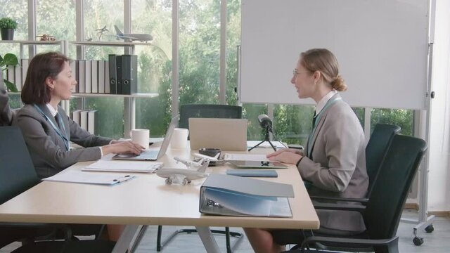 Airline business air hostess and captain aviator in uniform meeting discussion on flight business and training service of stewardess to understand yearly income and promotion
