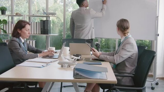 Airline business air hostess and captain aviator in uniform meeting discussion on flight business and training service of stewardess to understand yearly income and promotion
