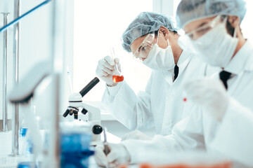 close up. group of scientists conduct research in the laboratory .