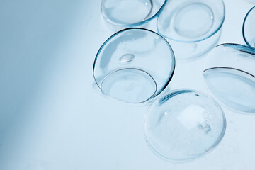 contact lenses on blue background close up view   - Image