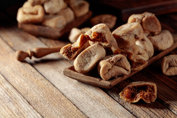 Dried figs on a old wooden table.